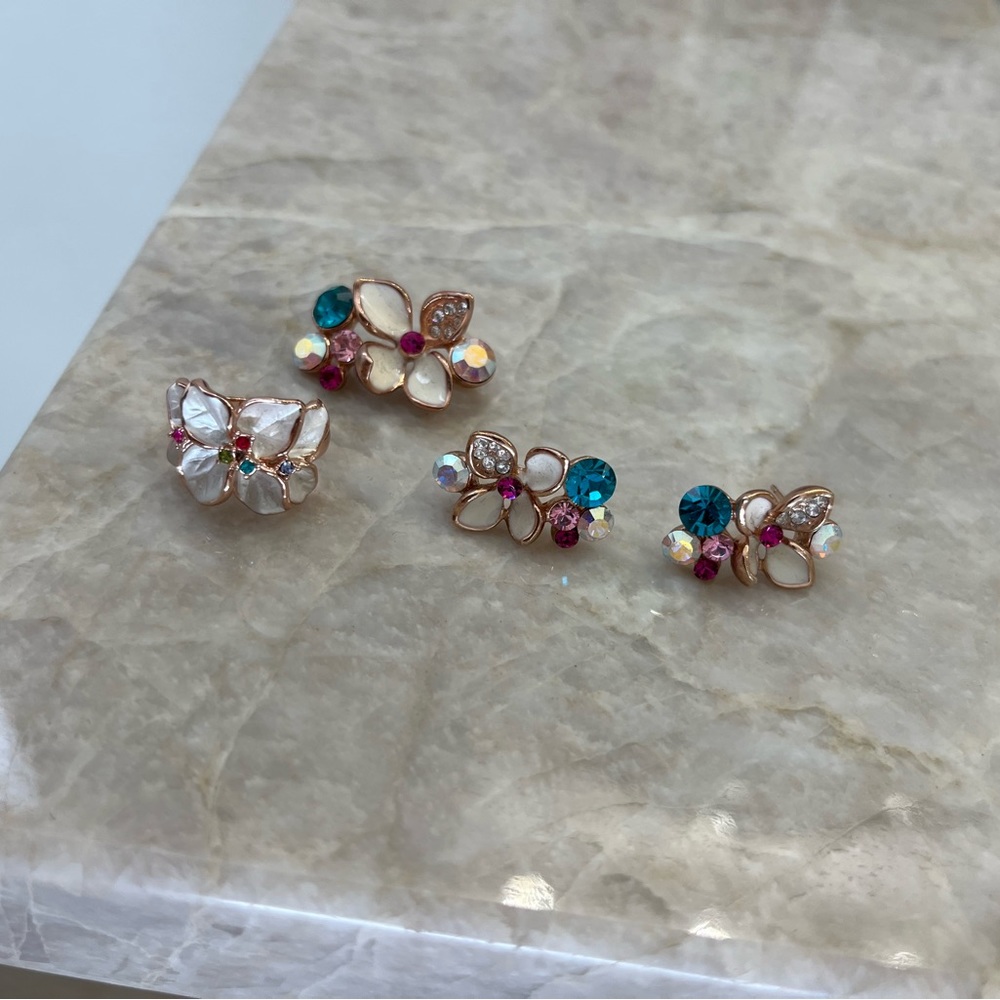 Swarovski Crystal Set including earrings, ring, and necklace pendant.